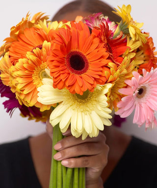 Person holding flowers